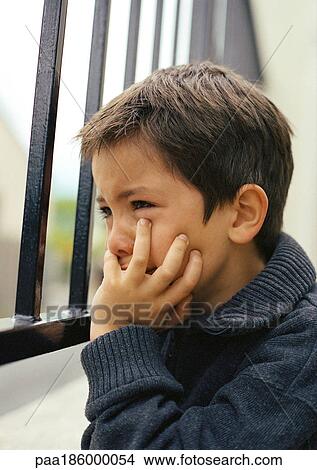 Child with hand under chin, close-up View Large Photo Image Picture - Child with hand under chin, close-up. Fotosearch