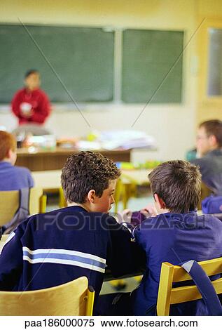 Children in classroom, rear view, chalkboard in background View Large Photo Image Stock Photography - Children in classroom, rear view, chalkboard in background. Fotosearch