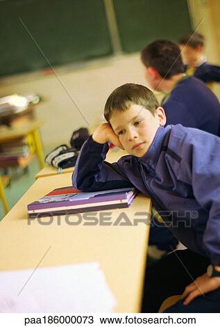 Stock Image - Children in classroom. Fotosearch