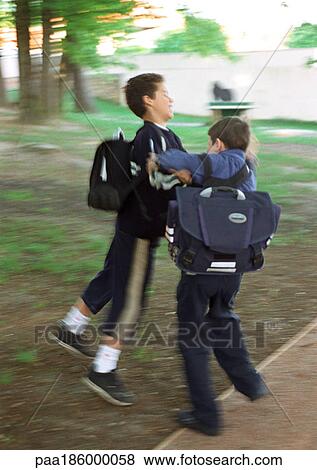 Children playfighting, full length, blurred motion View Large Photo Image Stock Photo - Children playfighting, full length, blurred motion. Fotosearch