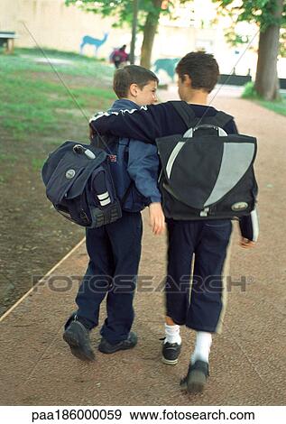 Children walking side by side, rear view View Large Photo Image Stock Photo - Children walking side by side, rear view. Fotosearch