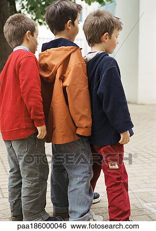 Three children in single file, side view, full length, close-up View Large Photo Image Stock Photograph - Three children in single file, side view, full length, close-up. Fotosearch