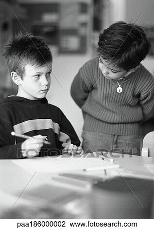 Two children, one holding pencil, b&w View Large Photo Image Stock Image - Two children, one holding pencil, b&w. Fotosearch