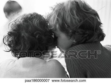 Stock Photo - Two children side by side, rear view, b&w. Fotosearch