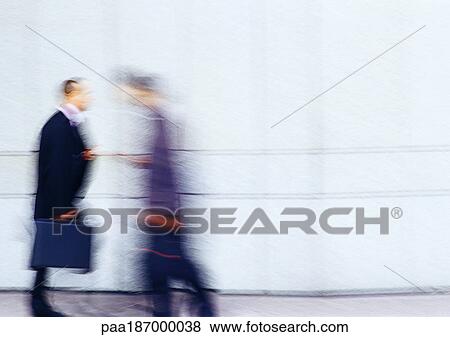 Businessman holding briefcase, blurred View Large Photo Image Stock Photo - Businessman holding briefcase, blurred. Fotosearch