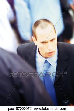 Businessman in crowd, close-up, elevated view View Large Photo Image Stock Image - Businessman in crowd, close-up, elevated view. Fotosearch