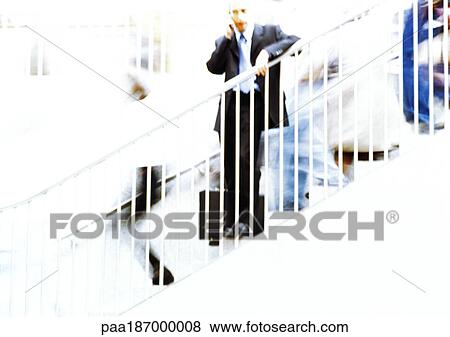 Businessman on stairs, blurred View Large Photo Image Stock Photo - Businessman on stairs, blurred . Fotosearch