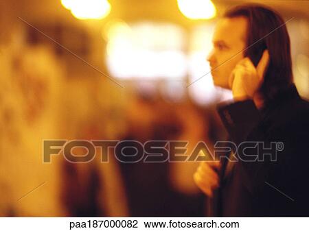 Businessman using cell phone, side view, blurred View Large Photo Image Stock Image - Businessman using cell phone, side view, blurred. Fotosearch