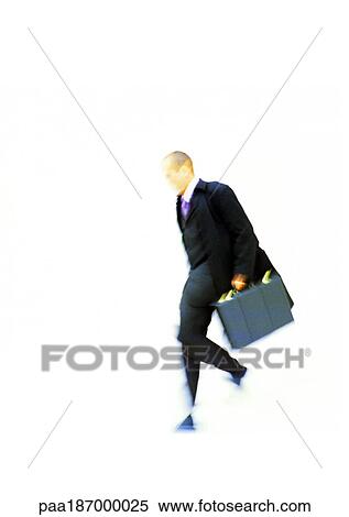 Businessman walking with briefcase in hand, elevated view View Large Photo Image Stock Photography - Businessman walking with briefcase in hand, elevated view. Fotosearch