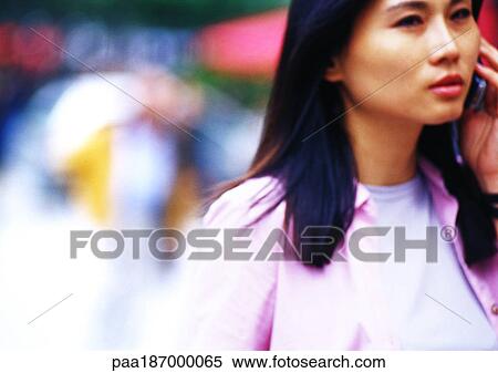 Businesswoman using cell phone, close-up View Large Photo Image Stock Photography - Businesswoman using cell phone, close-up. Fotosearch