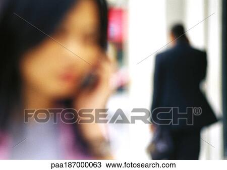 Businesswoman using cell phone, close-up, blurred View Large Photo Image Stock Image - Businesswoman using cell phone, close-up, blurred. Fotosearch