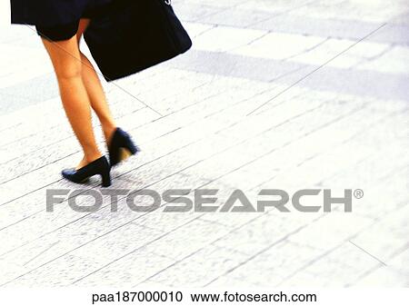 Businesswoman walking, low section View Large Photo Image Stock Image - Businesswoman walking, low section. Fotosearch