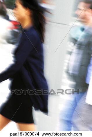 Businesswoman walking, side view, blurred View Large Photo Image Picture - Businesswoman walking, side view, blurred. Fotosearch