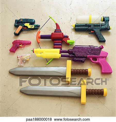 Children's toy swords and guns. View Large Photo Image Stock Photo - Children's toy swords and guns.. Fotosearch