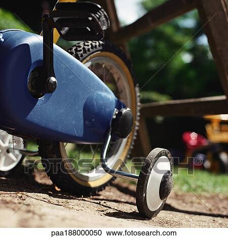 Child's bike with training wheels. View Large Photo Image Stock Image - Child's bike with training wheels.. Fotosearch