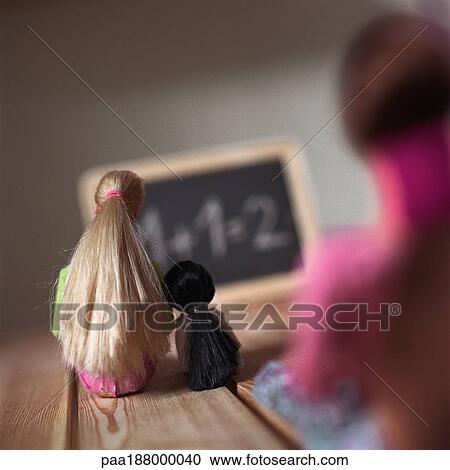 Child's dolls sitting on floor looking at chalkboard, rear view. View Large Photo Image Stock Image - Child's dolls sitting on floor looking at chalkboard, rear view.. Fotosearch