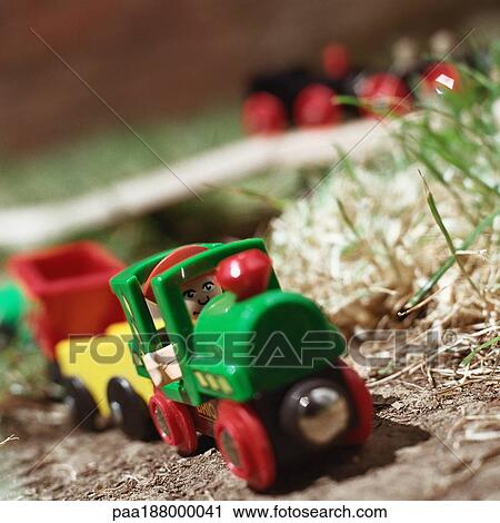 Child's toy train sitting on ground. View Large Photo Image Stock Image - Child's toy train sitting on ground.. Fotosearch