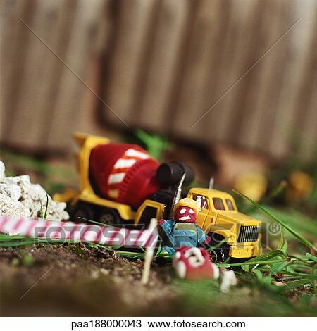 Child's toys sitting on grass. View Large Photo Image Stock Image - Child's toys sitting on grass.. Fotosearch