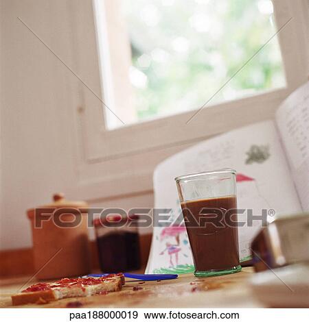 Food and drink next to child's book on floor. View Large Photo Image Stock Photo - Food and drink next to child's book on floor.. Fotosearch
