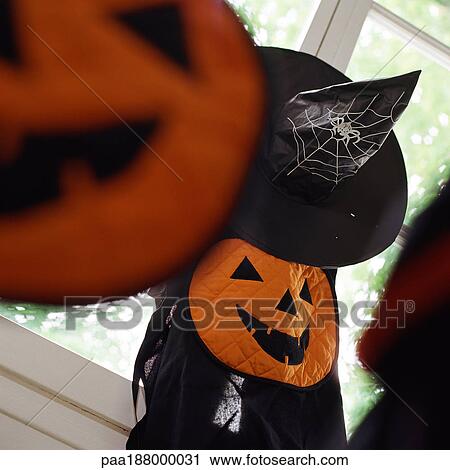 Halloween decorations hanging near window. View Large Photo Image Stock Image - Halloween decorations hanging near window.. Fotosearch
