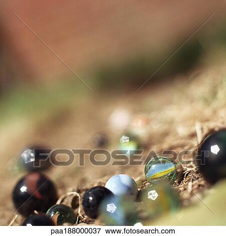 Marbles spread out on ground. View Large Photo Image Stock Photo - Marbles spread out on ground.. Fotosearch