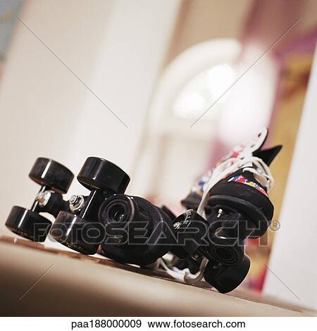 Pair of roller skates on floor. View Large Photo Image Stock Photo - Pair of roller skates on floor.. Fotosearch