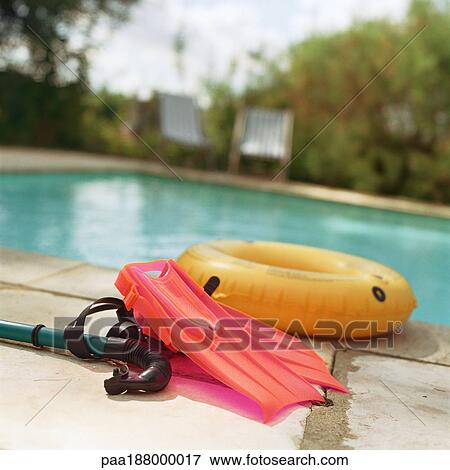 Pool toys sitting next to pool. View Large Photo Image Stock Photo - Pool toys sitting next to pool.. Fotosearch