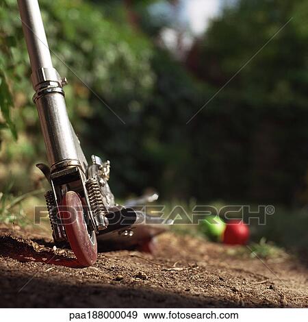 Push scooter sitting in dirt, close up. View Large Photo Image Stock Photo - Push scooter sitting in dirt, close up.. Fotosearch