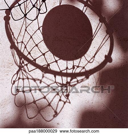 Stock Photo - Shadow of basketball and hoop.. Fotosearch