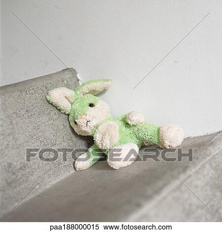 Stuffed rabbit sitting on step. View Large Photo Image Stock Photography - Stuffed rabbit sitting on step.. Fotosearch