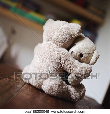 Stock Photography - Teddy bears hugging on table.. Fotosearch