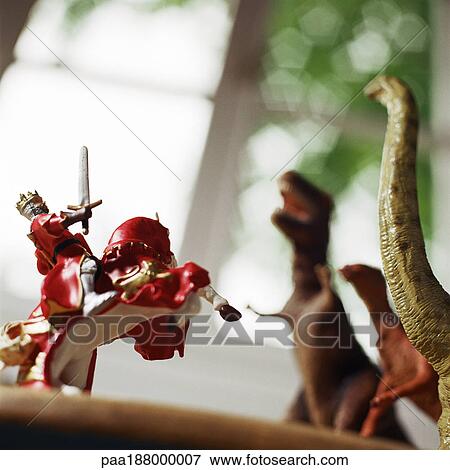 Toy knight fighting against toy dinosaurs. View Large Photo Image Stock Photo - Toy knight fighting against toy dinosaurs.. Fotosearch