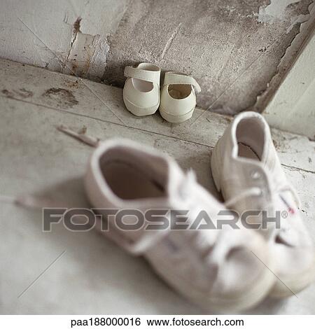 Two pairs of children's shoes on floor. View Large Photo Image Stock Photograph - Two pairs of children's shoes on floor.. Fotosearch