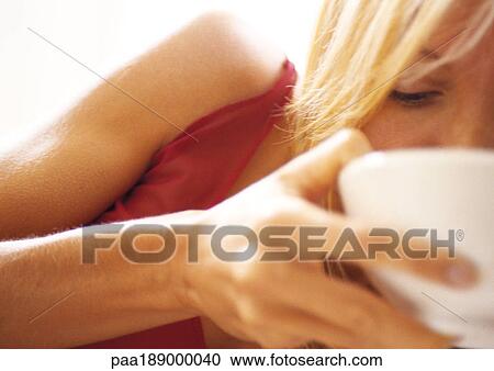 Woman sipping from bowl, close up View Large Photo Image Stock Image - Woman sipping from bowl, close up. Fotosearch