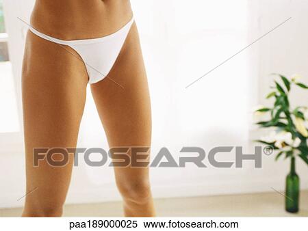 Woman standing in underwear, partial view. View Large Photo Image Stock Photography - Woman standing in underwear, partial view.. Fotosearch