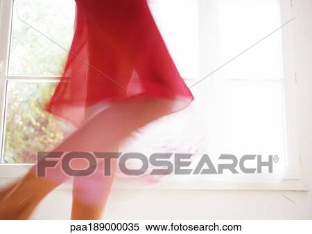 Woman walking in front of window, lower section, blurred motion. View Large Photo Image Stock Photography - Woman walking in front of window, lower section, blurred motion.. Fotosearch