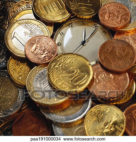Assorted euro coins and stop watch. View Large Photo Image Picture - Assorted euro coins and stop watch.. Fotosearch