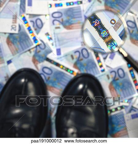 Dress shoes and magnifying glass on top of paper money. View Large Photo Image Stock Image - Dress shoes and magnifying glass on top of paper money.. Fotosearch