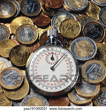 Stop watch and assorted euro coins. View Large Photo Image Stock Image - Stop watch and assorted euro coins.. Fotosearch