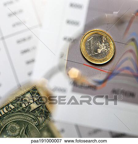 Stock Photo - U. S. dollar and Euro on top of financial charts.. Fotosearch
