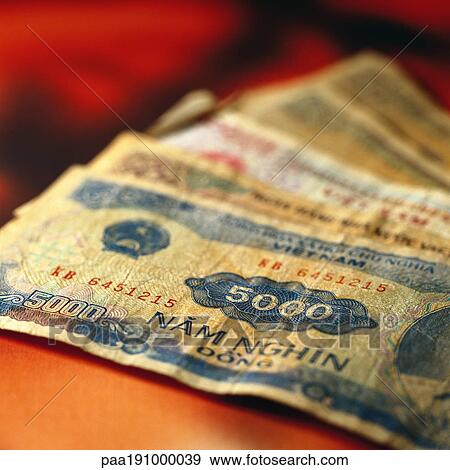 Vietnamese paper money on table. View Large Photo Image Stock Photo - Vietnamese paper money on table.. Fotosearch