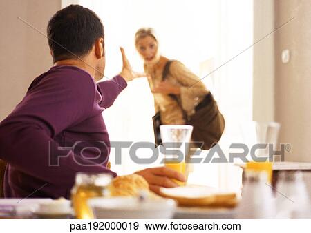 Man gesturing to woman leaving. View Large Photo Image Stock Photo - Man gesturing to woman leaving.. Fotosearch
