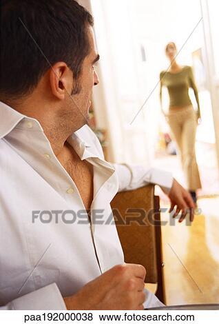 Man looking at blurred woman in background walking. View Large Photo Image Stock Photo - Man looking at blurred woman in background walking.. Fotosearch