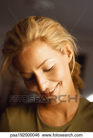 Woman, head down, smiling, close-up, portrait. View Large Photo Image Stock Photograph - Woman, head down, smiling, close-up, portrait.. Fotosearch