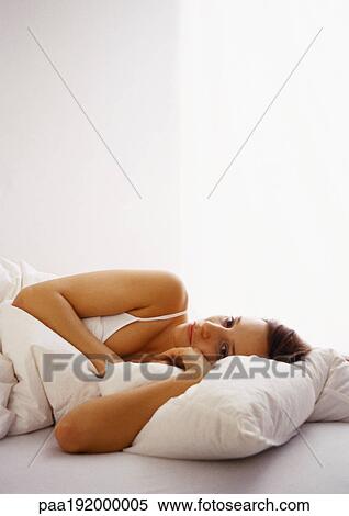 Woman lying in bed. View Large Photo Image Stock Photography - Woman lying in bed.. Fotosearch