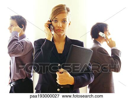 Business people talking on cell phones View Large Photo Image Stock Photo - Business people talking on cell phones. Fotosearch