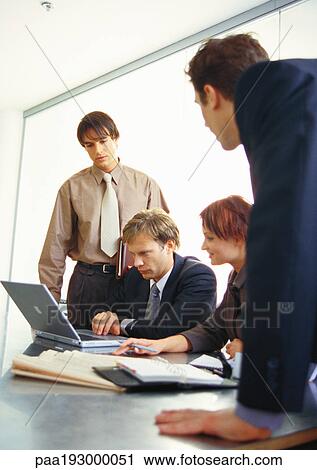 Business people working together at table. View Large Photo Image Stock Image - Business people working together at table.. Fotosearch