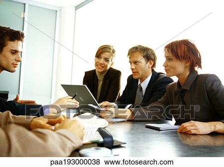 Business people working together at table. View Large Photo Image Stock Photo - Business people working together at table.. Fotosearch