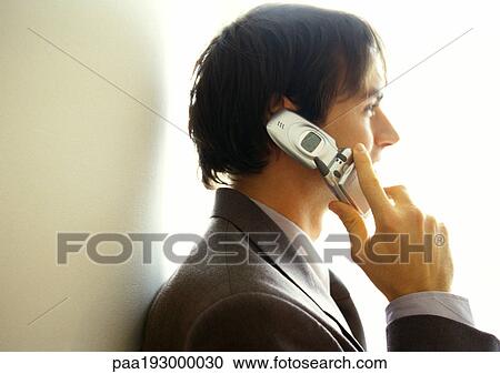 Businessman on cell phone, side view, head and shoulders View Large Photo Image Stock Image - Businessman on cell phone, side view, head and shoulders. Fotosearch