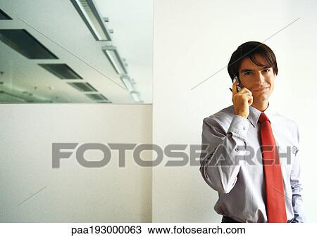 Businessman talking on cell phone, off centered, waist up. View Large Photo Image Stock Image - Businessman talking on cell phone, off centered, waist up.. Fotosearch